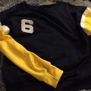 Blue, white, and yellow sweatshirt.